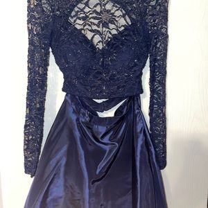 Navy blue Windsor two piece dress. Long sleeves with pockets and open back